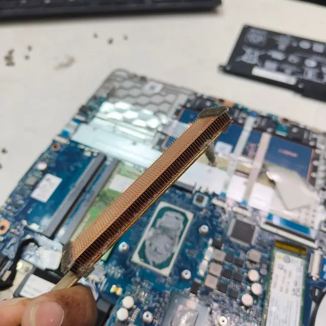 Clogged laptop heatsink fins dust removal