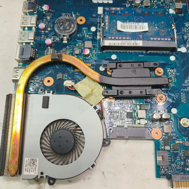 Dell laptop motherboard CPU fan heatsink RAM slot closeup