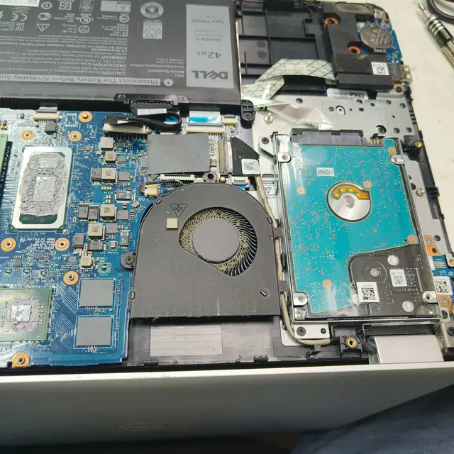Dell laptop opened dusty fan and old thermal paste on CPU