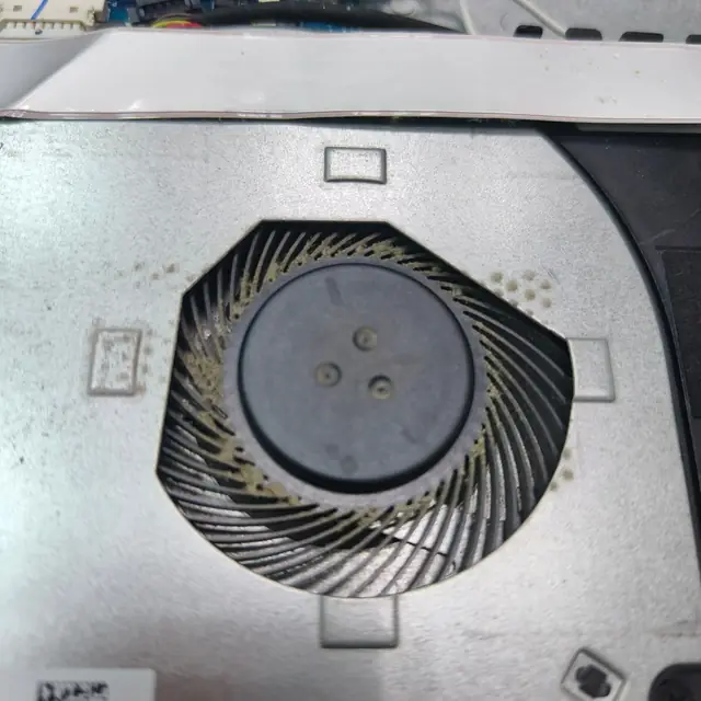 Dusty laptop cooling fan cleaning overheating fix