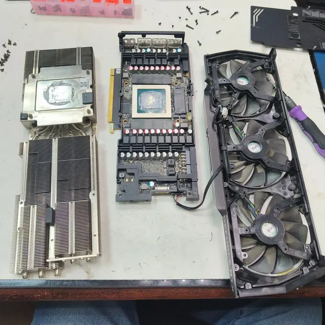 Graphics card disassembled heatsink GPU old thermal paste and dusty fans