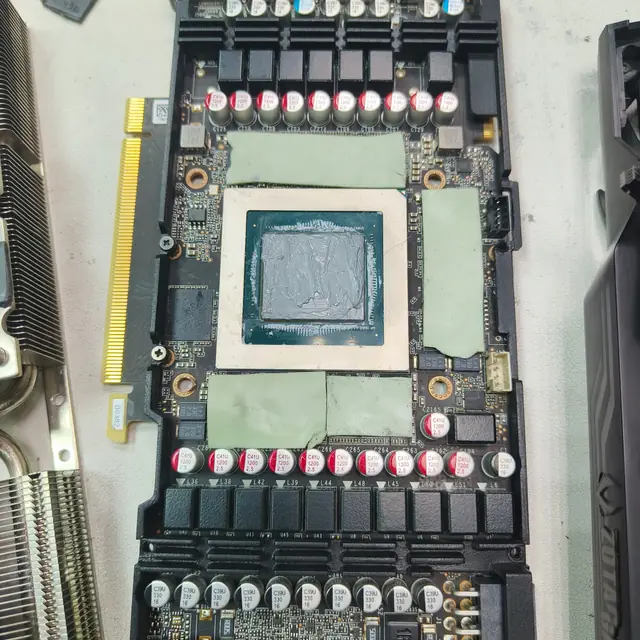 Graphics card GPU die old thermal paste and green thermal pads