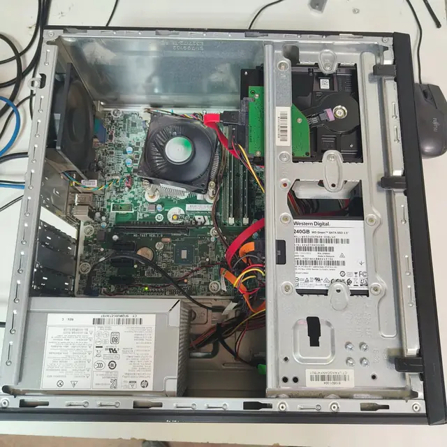 HP desktop PC opened motherboard PSU SSD and hard drive