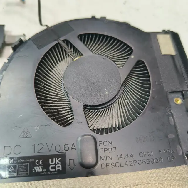 Laptop cooling fan 12V label dust on blades