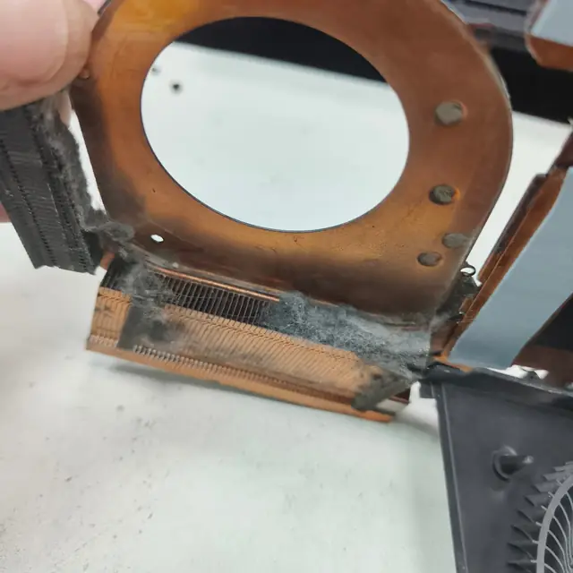 Laptop cooling system dust buildup underside