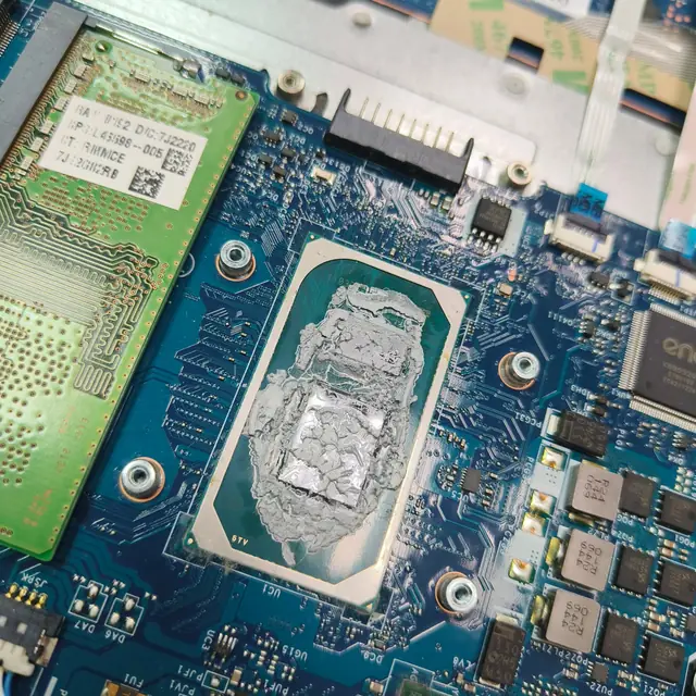 Laptop CPU old dried thermal paste before cleaning