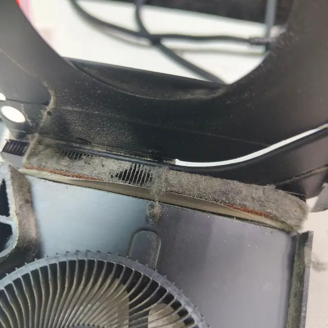 Laptop heatsink exhaust fins blocked by lint and hair