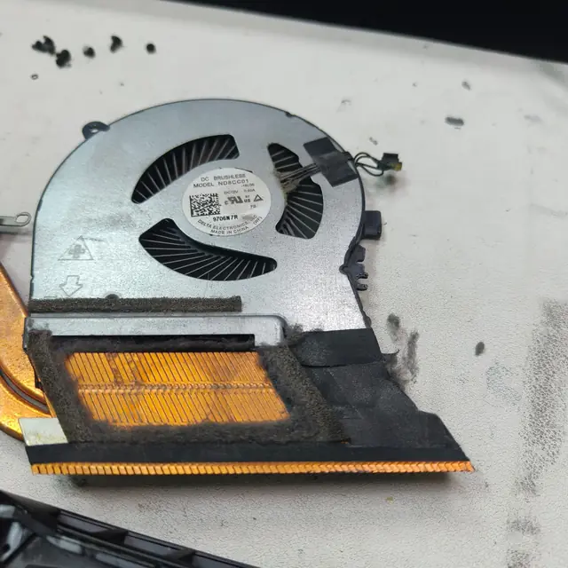 Laptop heatsink fan clogged with dust needs cleaning