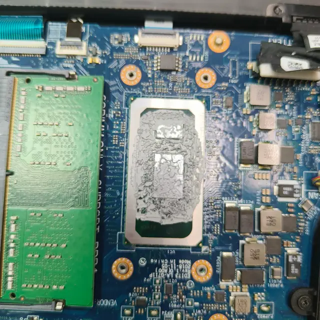 Laptop motherboard Intel CPU old dried thermal paste before repaste