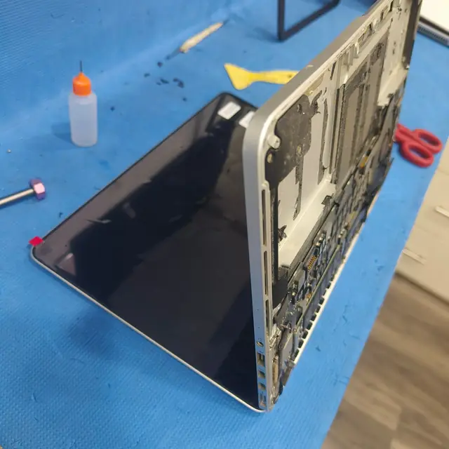 MacBook Pro Retina 13 inch opened on repair bench